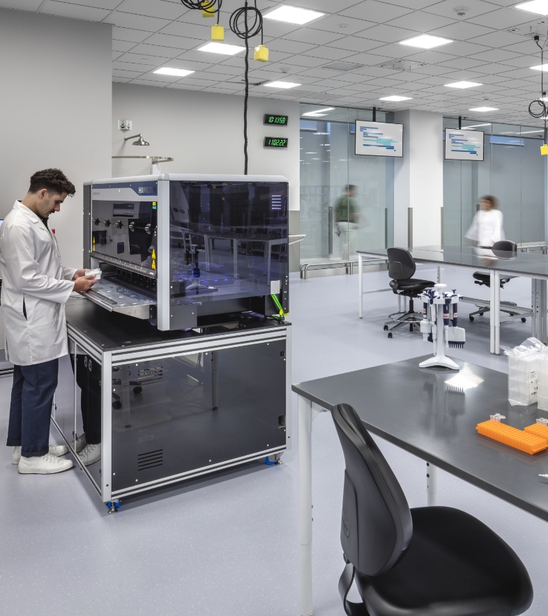 Flad Architects Scientists and Researchers using Laboratory Automation Equipment