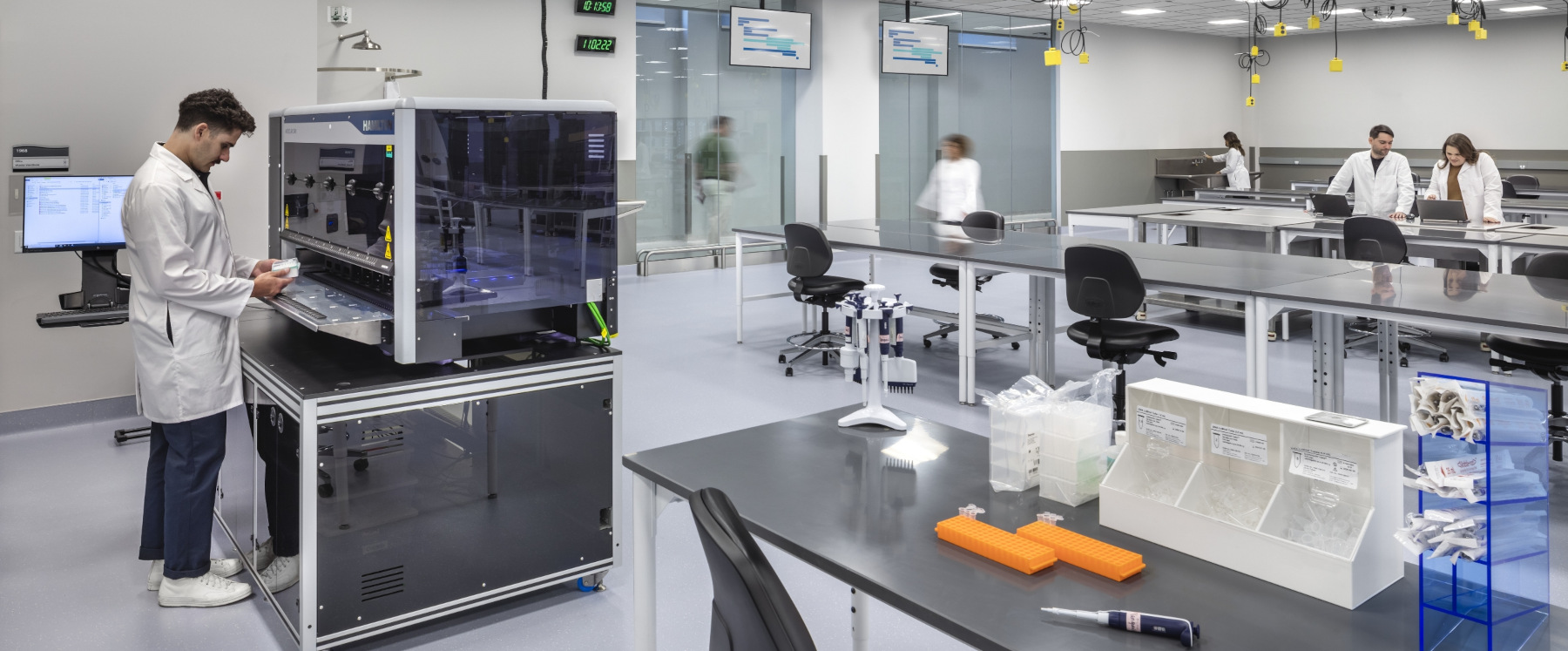 Flad Architects Scientists and Researchers using Laboratory Automation Equipment